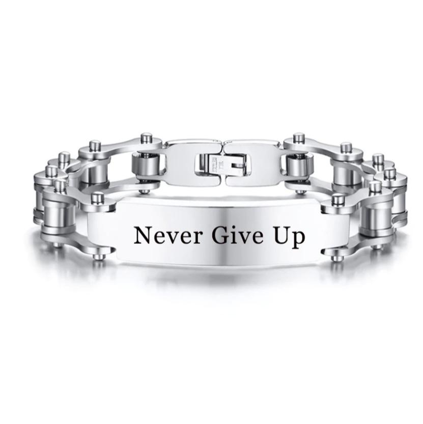 Silver bracelet with 'Never Give Up' engraving on a white background