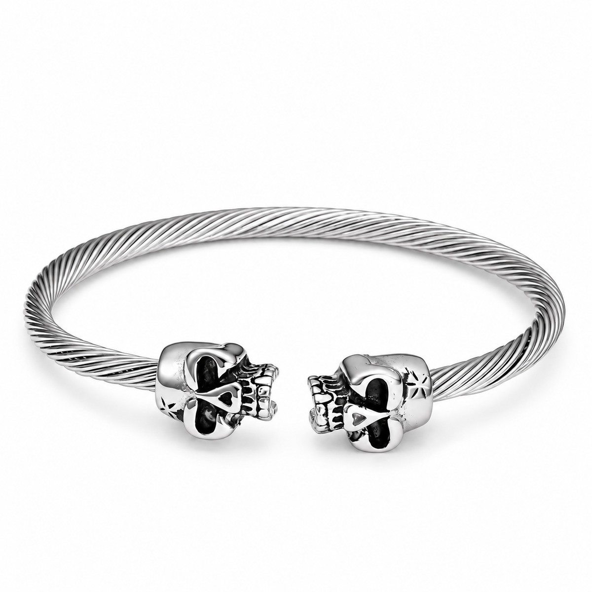Open Cuff Skull Bracelet — silver finish with twin skull ends and textured band, on a white background