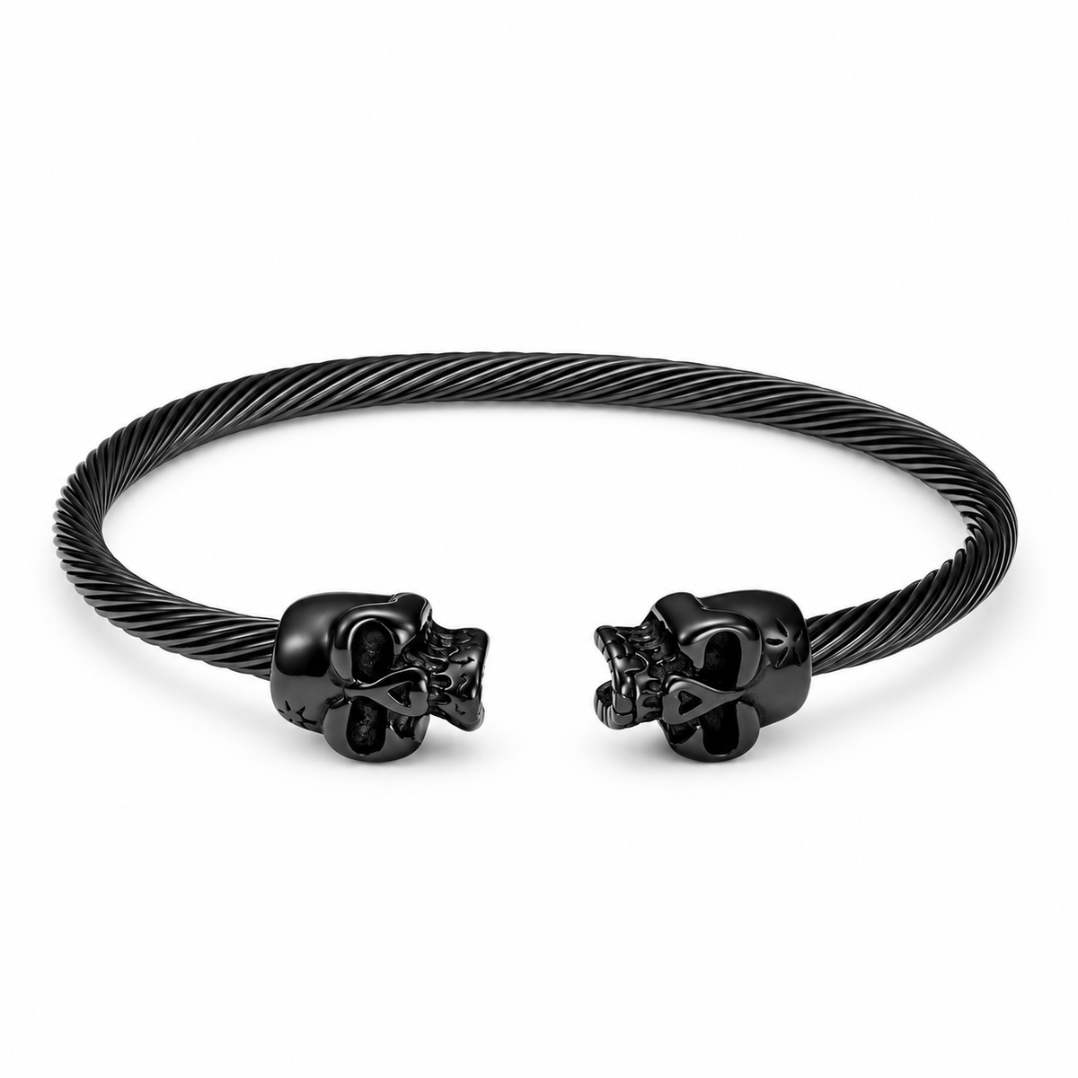 Open Cuff Skull Bracelet — black finish with twin skull ends and textured band, on a white background